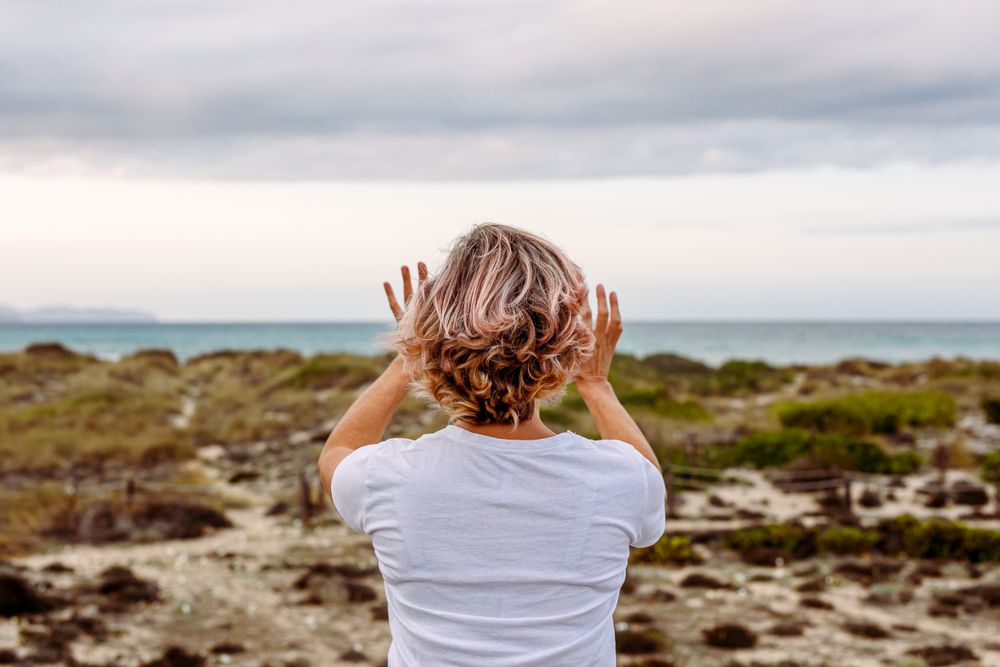 Adult woman practicing martial arts in nature