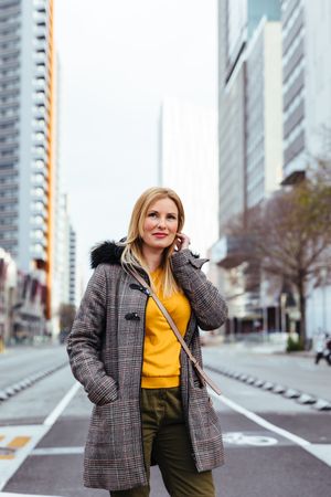 Blonde woman posing in the city
