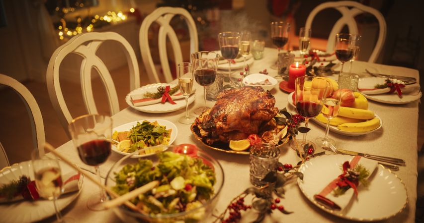 Close Up of a Delicious Turkey Roast with Baked Potatoes on a Festive Table.