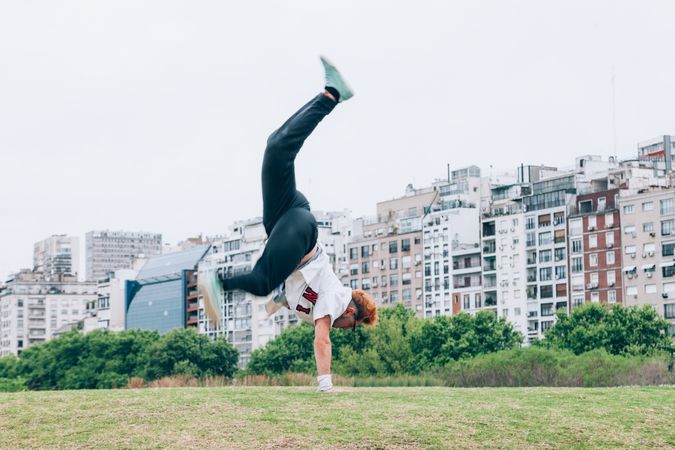 Sportsman practicing hip hop on lawn