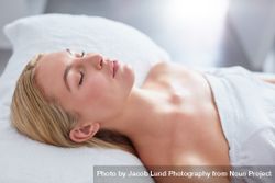Blonde woman lying back and relaxing after beauty treatment 5ngk8D