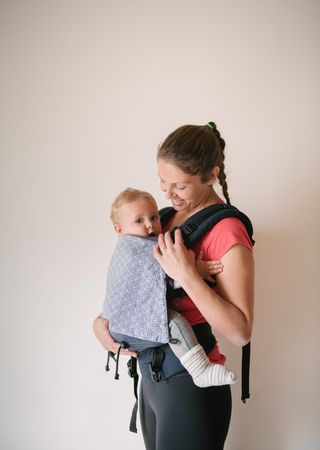 Sporty mother with baby in gym