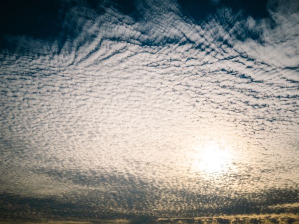 Picturesque cloudy sky at sundown