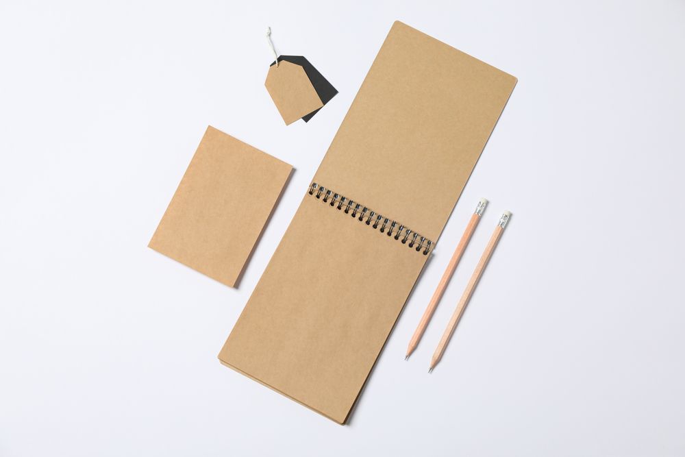 Composition with blank stationery on plain background, space for text