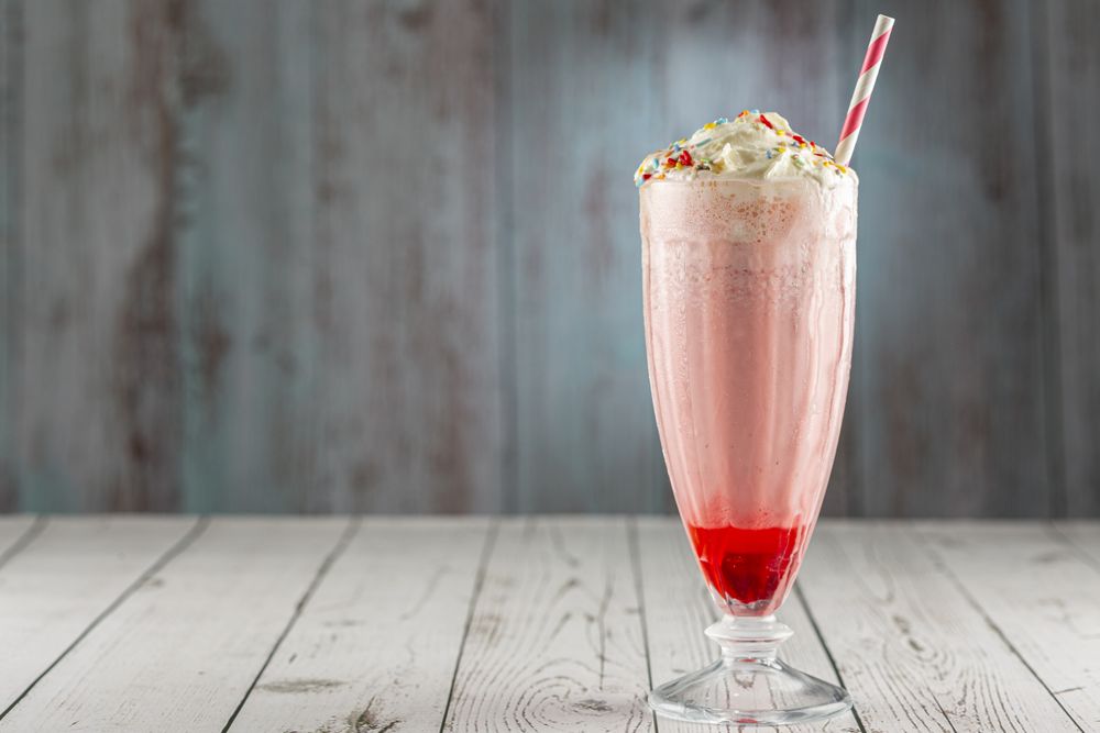 Strawberry milkshake with whipped cream.