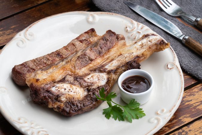 Meat dish served with sauce on plate