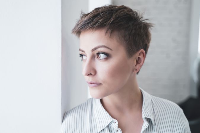 Woman posing after cutting her hair