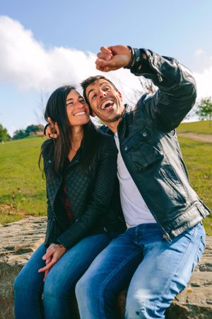 Couple taking a selfie with a smartwatch