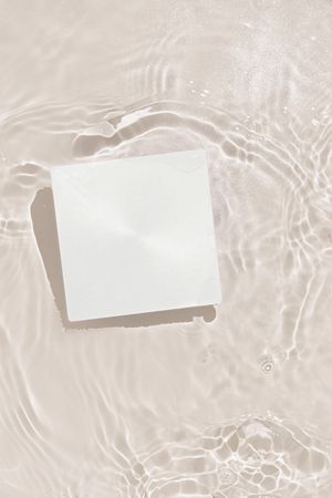 Paper card floating in water