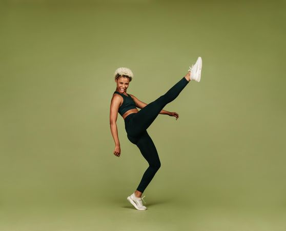 Black female athlete doing warm up exercises