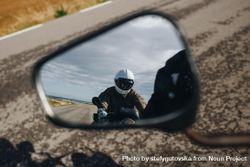 Motorcyclist as seen in rear-view mirror 5oPzz4