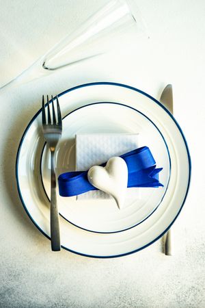 Top view of table setting with blue Valentine theme