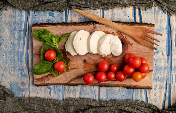 Salad ingredients on board and napkin