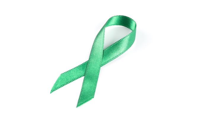 Green awareness ribbon isolated on blank background