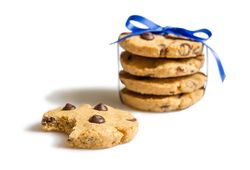 Closeup of chocolate chip cookies pile isolated on plain background