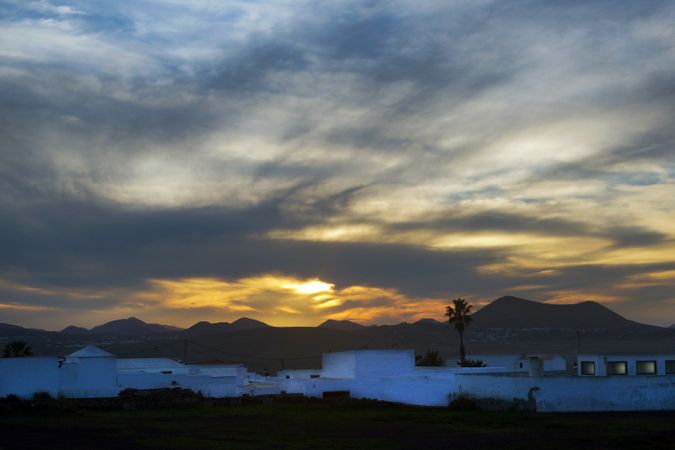 Amazing landscape of houses placed on remote sunset in Lanzarote, Canary islands, Spain