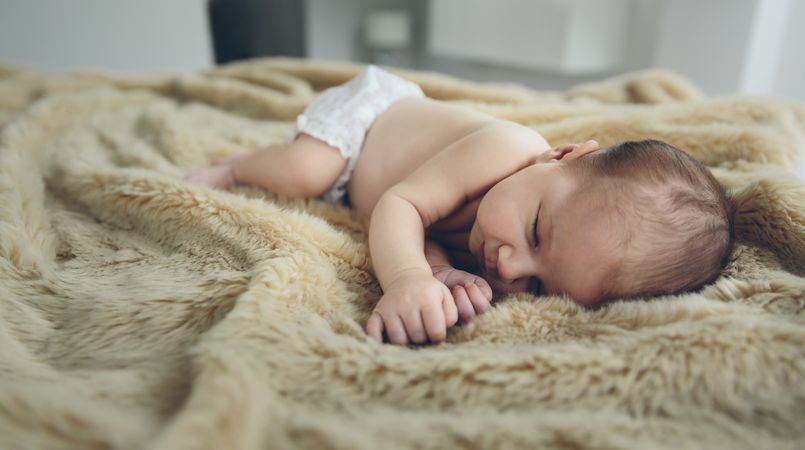 Baby sleeping on a blanket