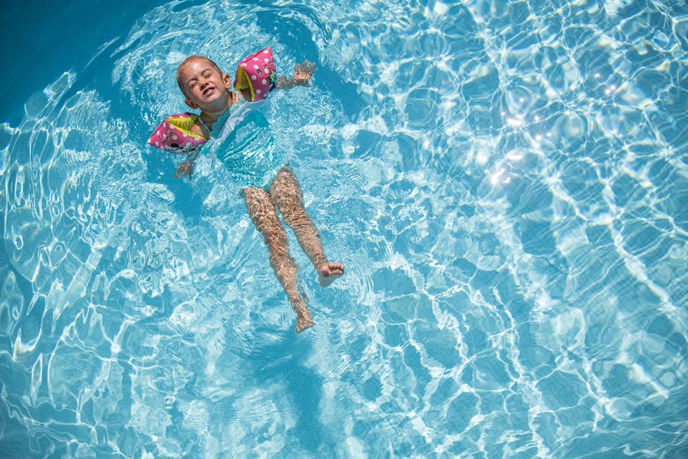 Girl leaning back in the water