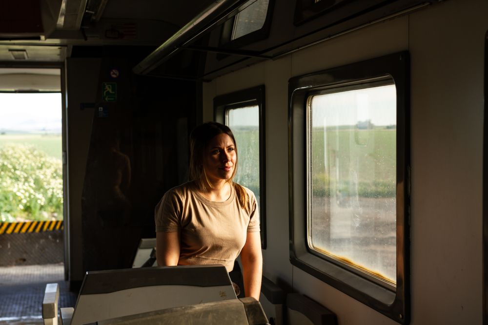 Military woman travelling looking out van window