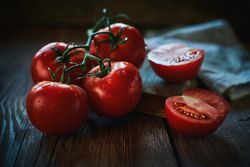 Fresh tomatoes on wooden table