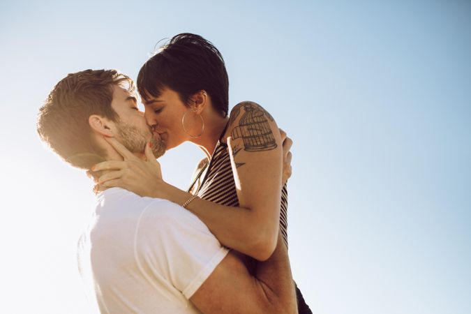 Affectionate woman kissing her boyfriend