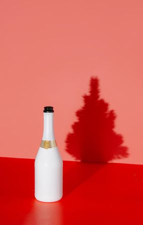 Champagne bottle with Christmas tree shadow