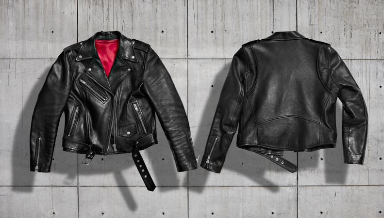 Dark leather jacket set on concrete