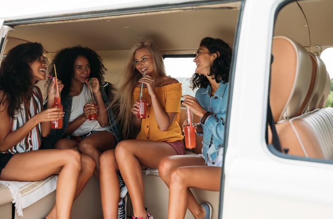 Four people in a car during a road trip