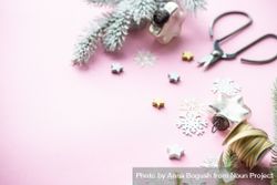 Christmas decorations of snowflakes and stars on pink background with copy space 4dnYd0