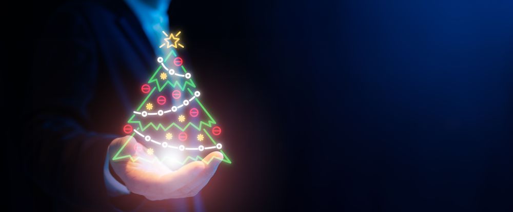 Businessman with holographic Christmas tree