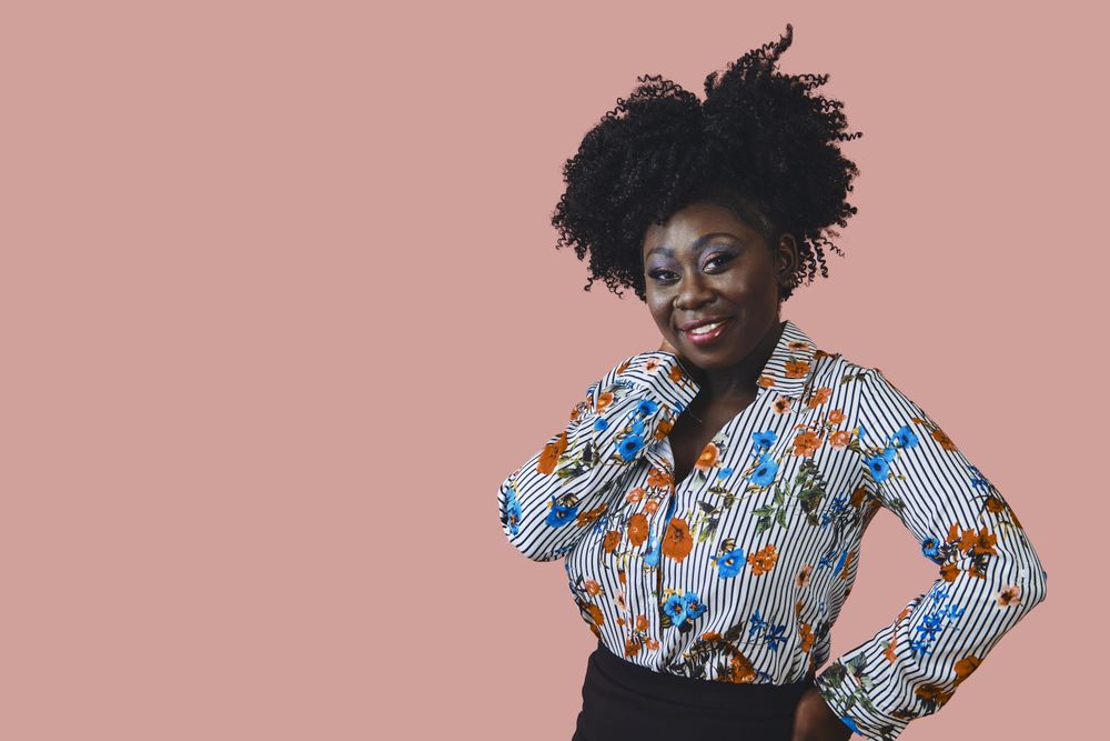 Portrait of stylish Black woman smiling looking at camera