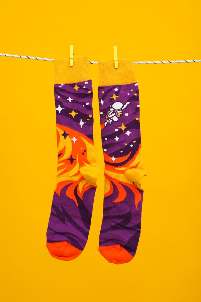 Concept of clothes for legs - socks, socks hanging on rope