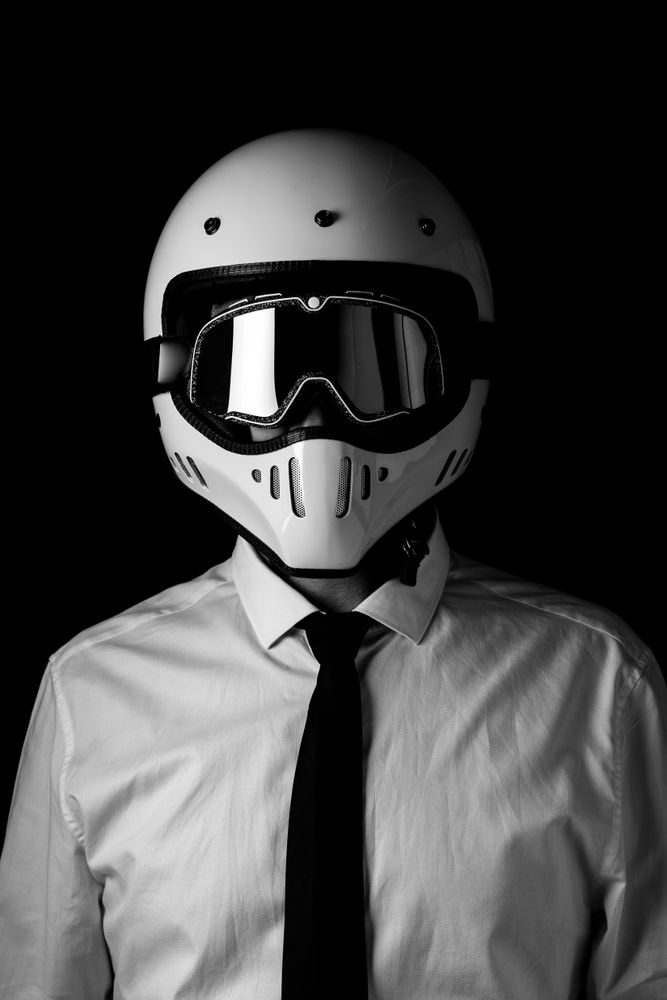 Rider in helmet and glasses at studio