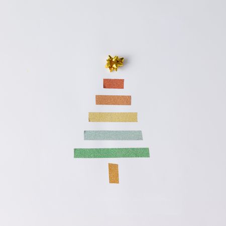 Minimalistic Christmas tree made of tape on light background