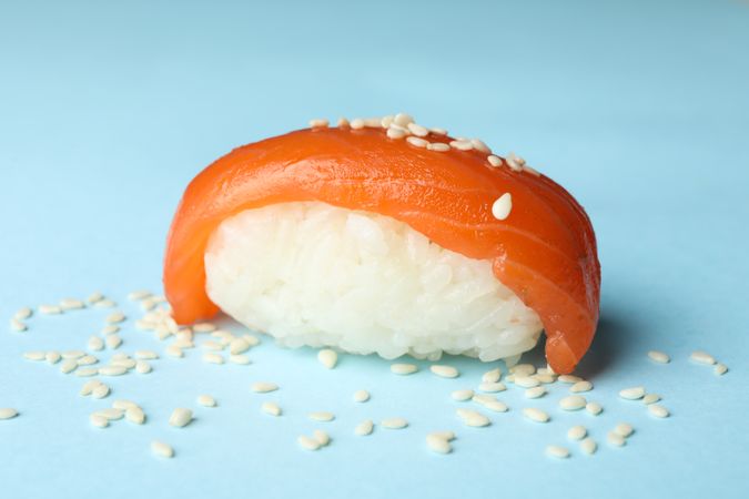 Sushi roll on blue background, close up. Japanese food