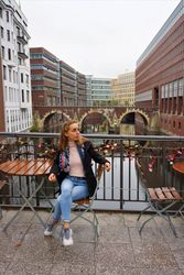 Woman sitting at a table outdoor in Hamburg, Germany