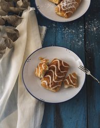 Homemade tasty sweet rolls on plates