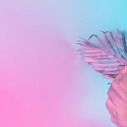 Tropical and palm leaves in vibrant bold gradient holographic colors