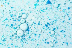Macro shot of blue bubbles on blue background