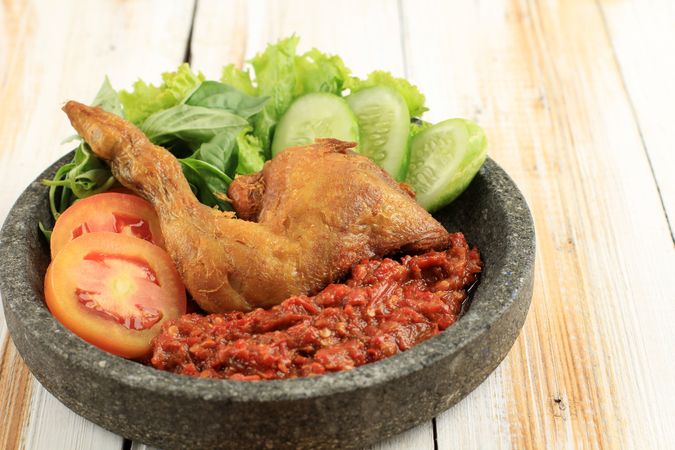Bowl of chicken Indonesian dish served with sambal paste