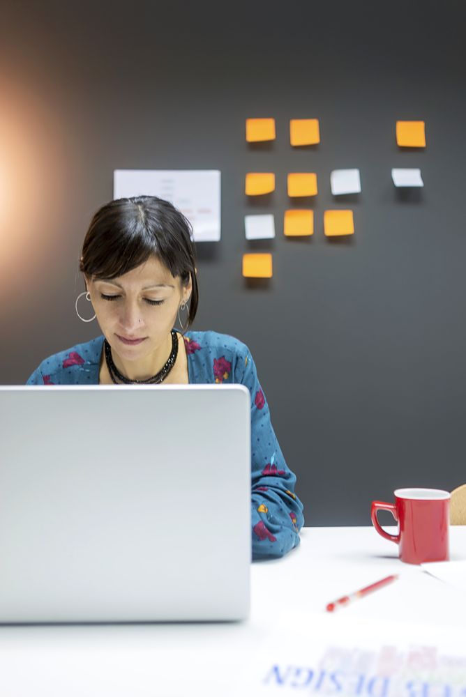 Smiling businesswoman working with laptop