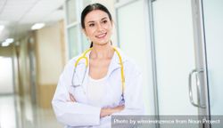 Portrait of happy female doctor with stethoscope 0K2PZb