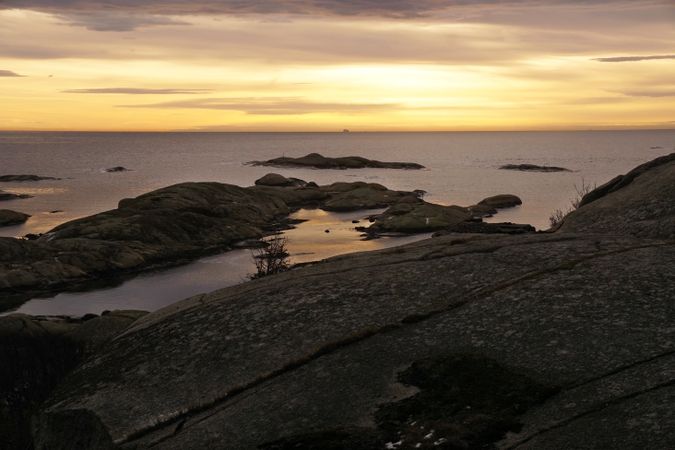 Rocky seashore at peaceful sunset