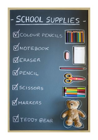 School supplies over chalkboard background