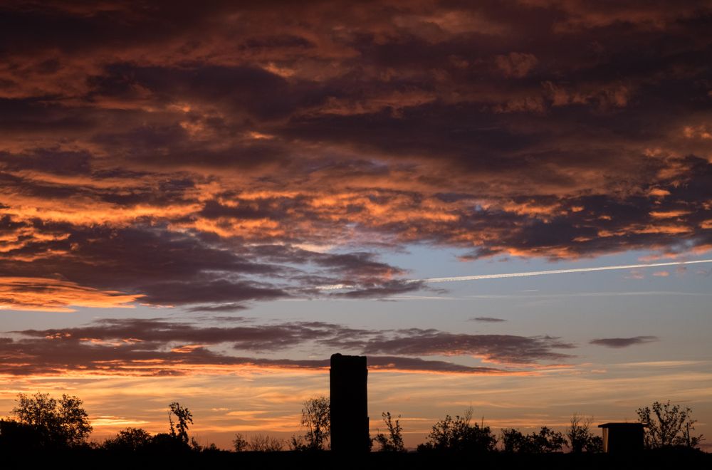 Orange and blue cloudy sky at sunset over France