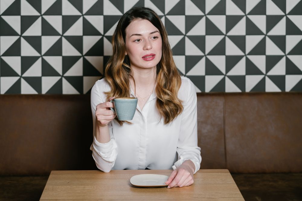 Young woman sitting at cafe