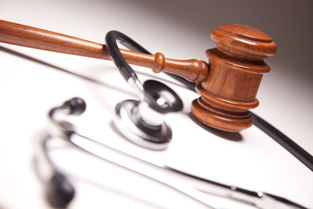 Gavel and Stethoscope on Gradated Background