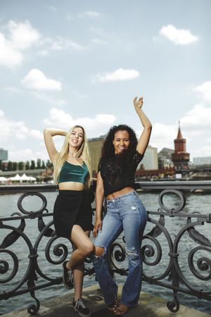 Cheerful friends on city river