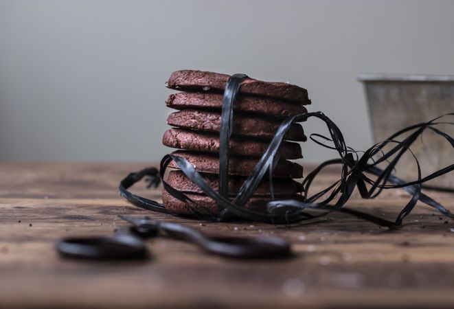 Stack of chocolate cookies tied with black ribbon
