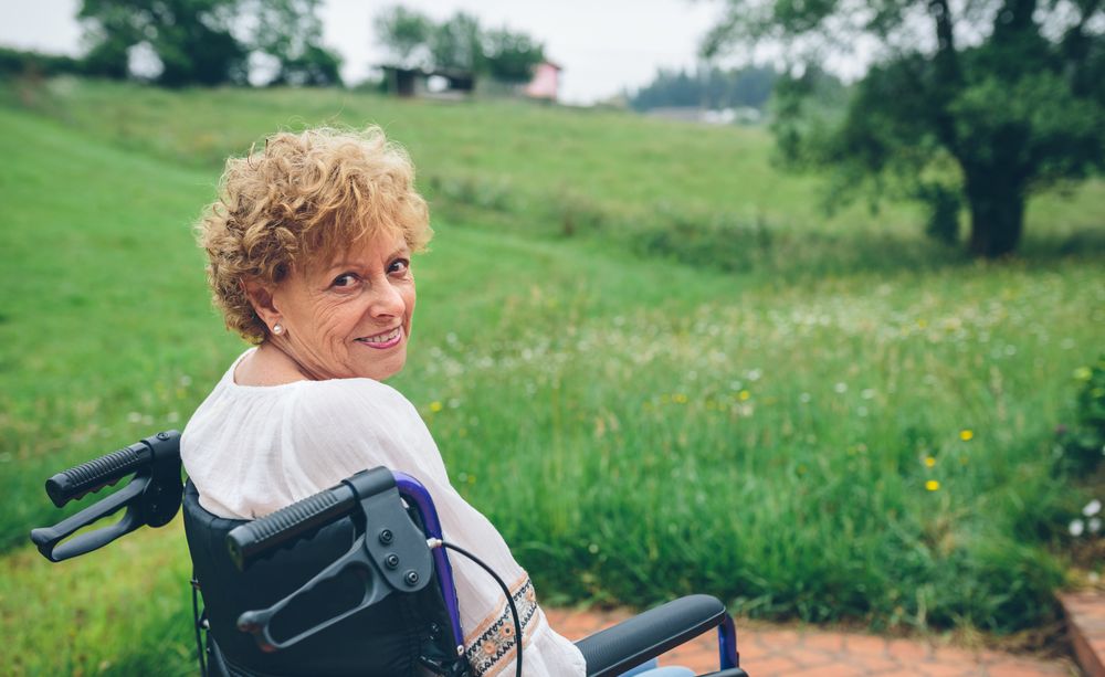 Woman in wheelchair in garden